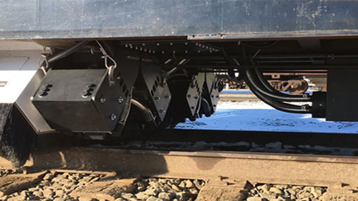 Close-up of machinery under a train